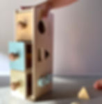 Child holding LETme Toys Three Drawer Object Sorter