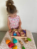 Child playing with sensory play items
