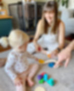 Child and mother with LEtme Toys Wooden Rainbow Hearts